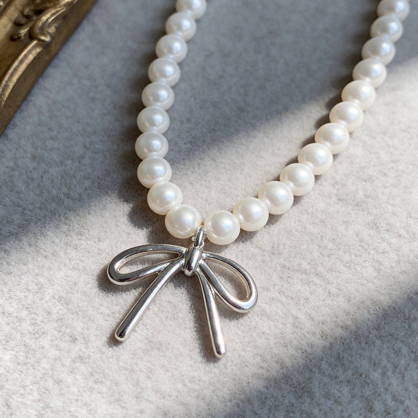 Pearl Necklace with Silver Bow