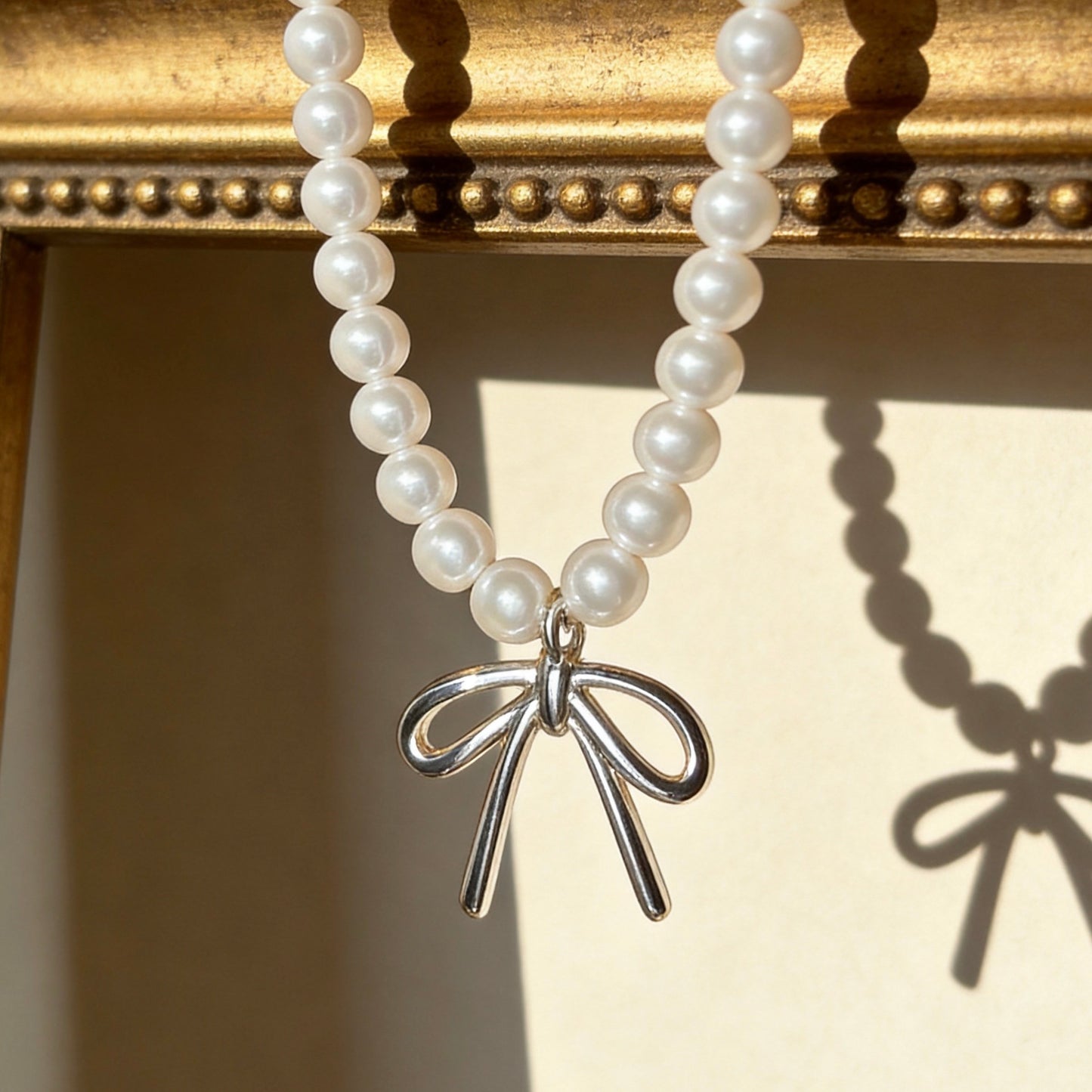 Pearl Necklace with Silver Bow