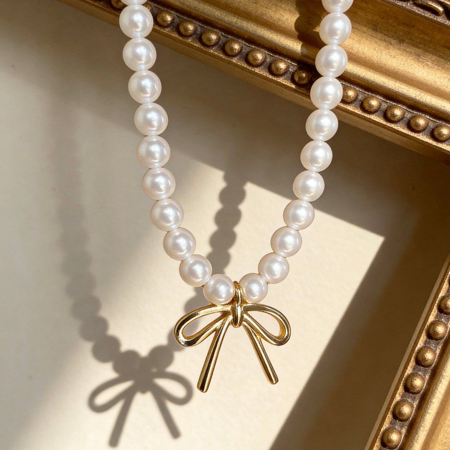 Pearl Pendant Necklace With Gold Bow