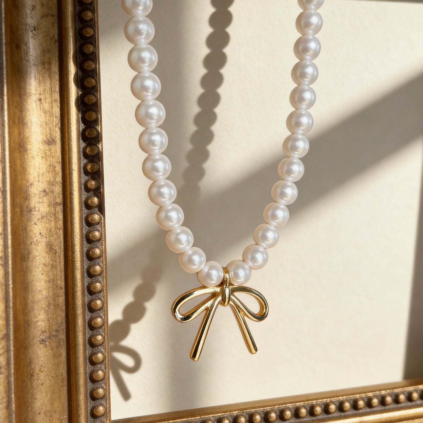 Pearl Pendant Necklace With Gold Bow